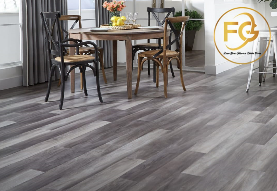 Stylish dining area with wooden chairs, a round wooden table, and gray-toned laminate flooring