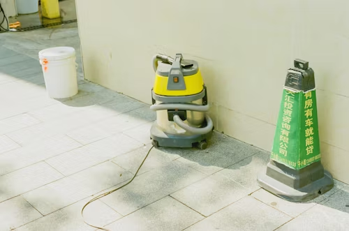 Cleaning machines ad vacuuming the floor