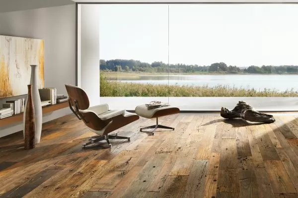 Light and brown flooring with chairs and a huge window