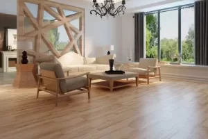 A lounge with furniture, large window, and wooden flooring